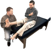 Chiropodist examining patient's foot